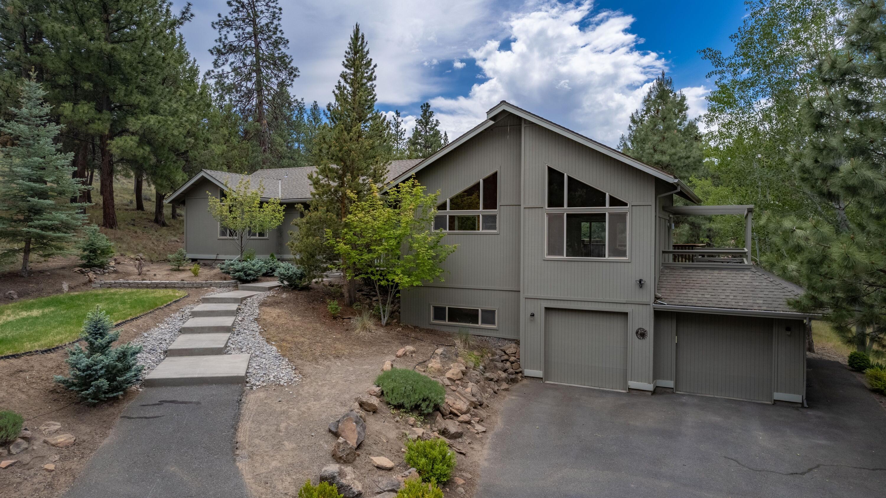 2255 Northwest Putnam Road Bend, OR 97703 - Photo 45 of 49 There is a flight of stairs up from the garage or there is a nice walkway path up to the front door from the driveway.