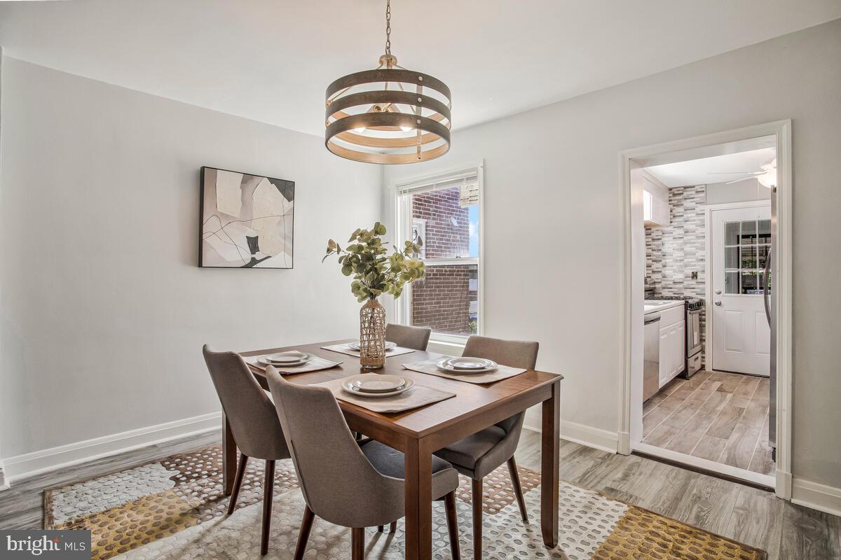 617 Annabel Avenue Baltimore, MD 21225 - Photo 13 of 40 a dining room with furniture and window