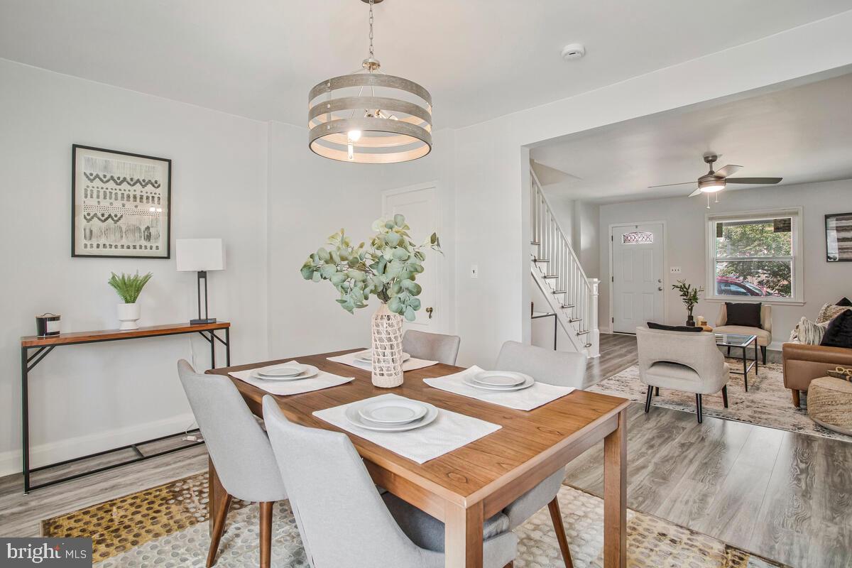 617 Annabel Avenue Baltimore, MD 21225 - Photo 15 of 40 a view of a dining room with furniture and chandelier