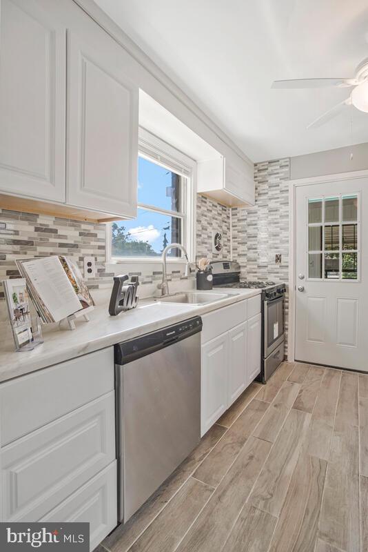 617 Annabel Avenue Baltimore, MD 21225 - Photo 17 of 40 a kitchen with stainless steel appliances granite countertop a sink and cabinets