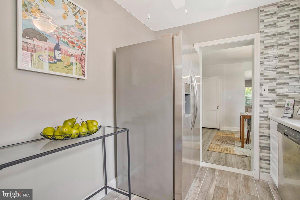 617 Annabel Avenue Baltimore, MD 21225 - Photo 18 of 40 a bathroom with a granite countertop sink and a mirror