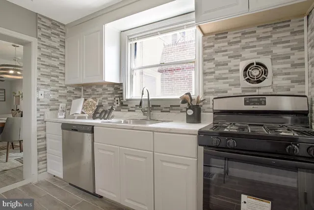 a kitchen with a stove and a sink