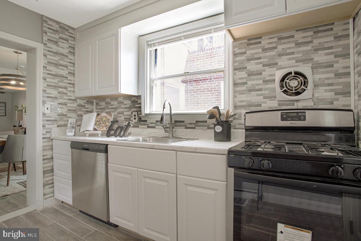 617 Annabel Avenue Baltimore, MD 21225 - Photo 20 of 40 a kitchen with a stove and a sink