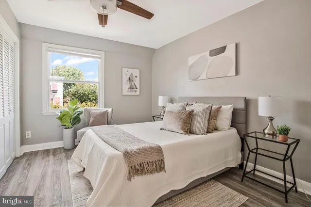 a bedroom with a bed and a chair