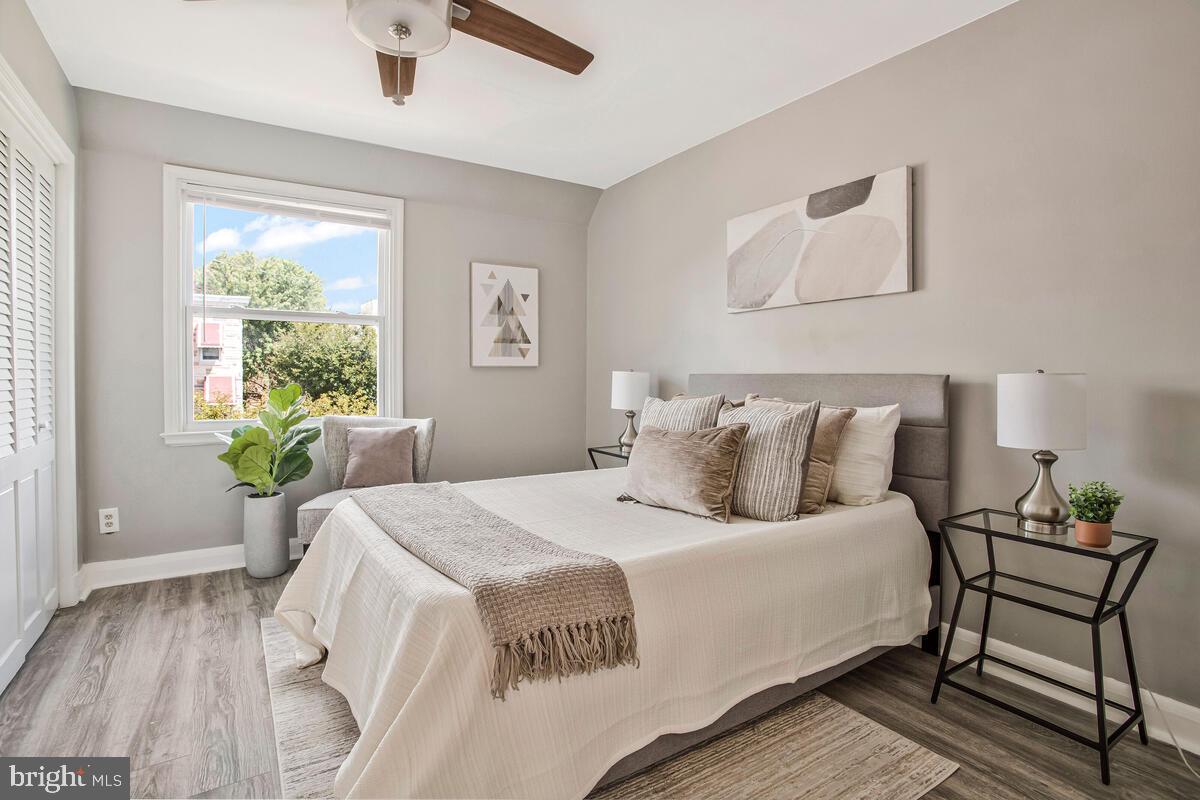 617 Annabel Avenue Baltimore, MD 21225 - Photo 23 of 40 a bedroom with a bed and a chair