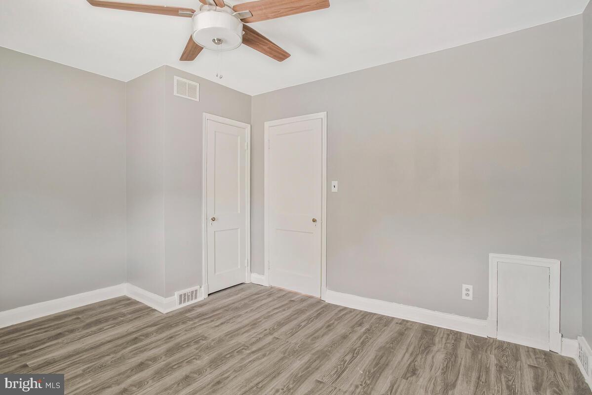 617 Annabel Avenue Baltimore, MD 21225 - Photo 28 of 40 wooden floor in an empty room