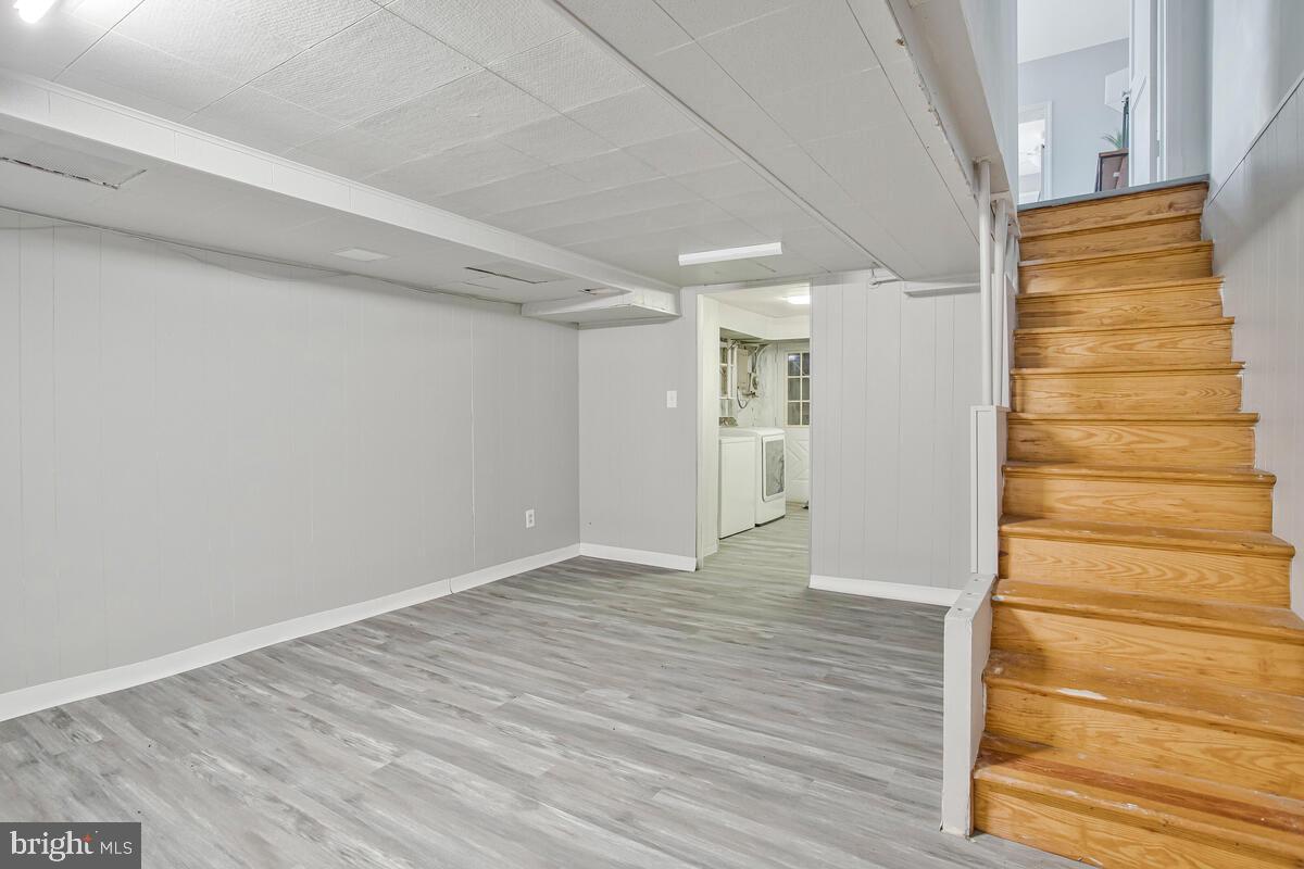 617 Annabel Avenue Baltimore, MD 21225 - Photo 29 of 40 a view of an empty room with wooden floor and entryway