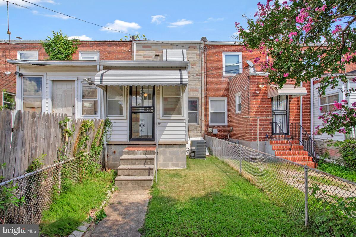 617 Annabel Avenue Baltimore, MD 21225 - Photo 37 of 40 a front view of a house with garden