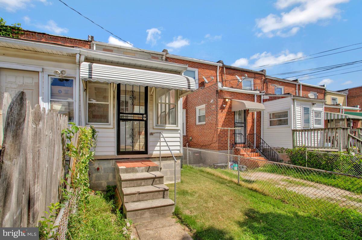 617 Annabel Avenue Baltimore, MD 21225 - Photo 39 of 40 front view of a house with a yard
