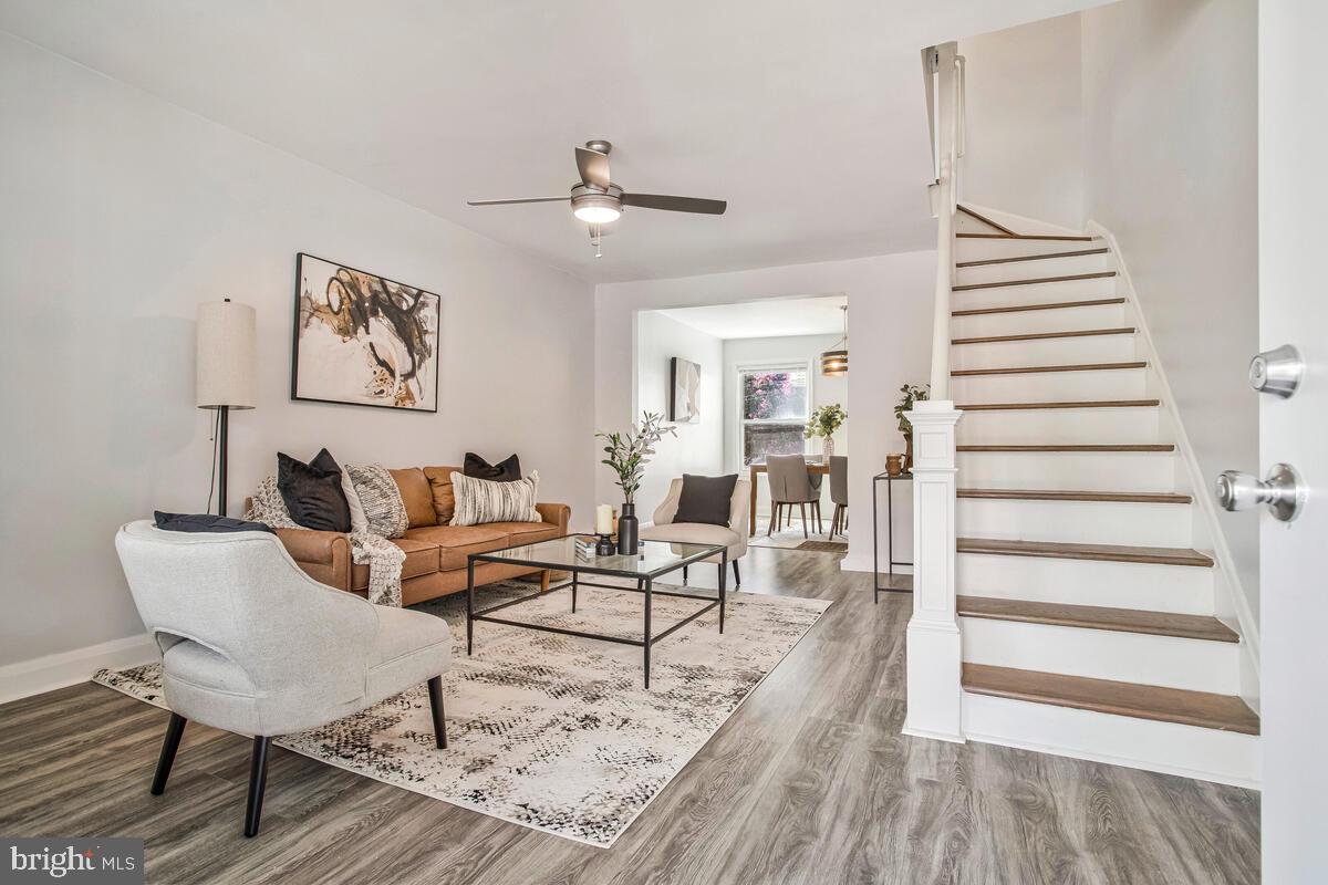 617 Annabel Avenue Baltimore, MD 21225 - Photo 6 of 40 a living room with furniture and wooden floor