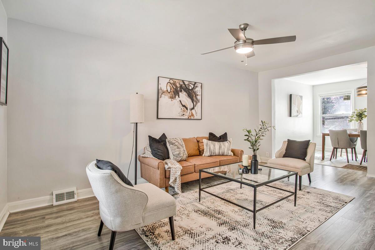 617 Annabel Avenue Baltimore, MD 21225 - Photo 7 of 40 a living room with furniture and a wooden floor