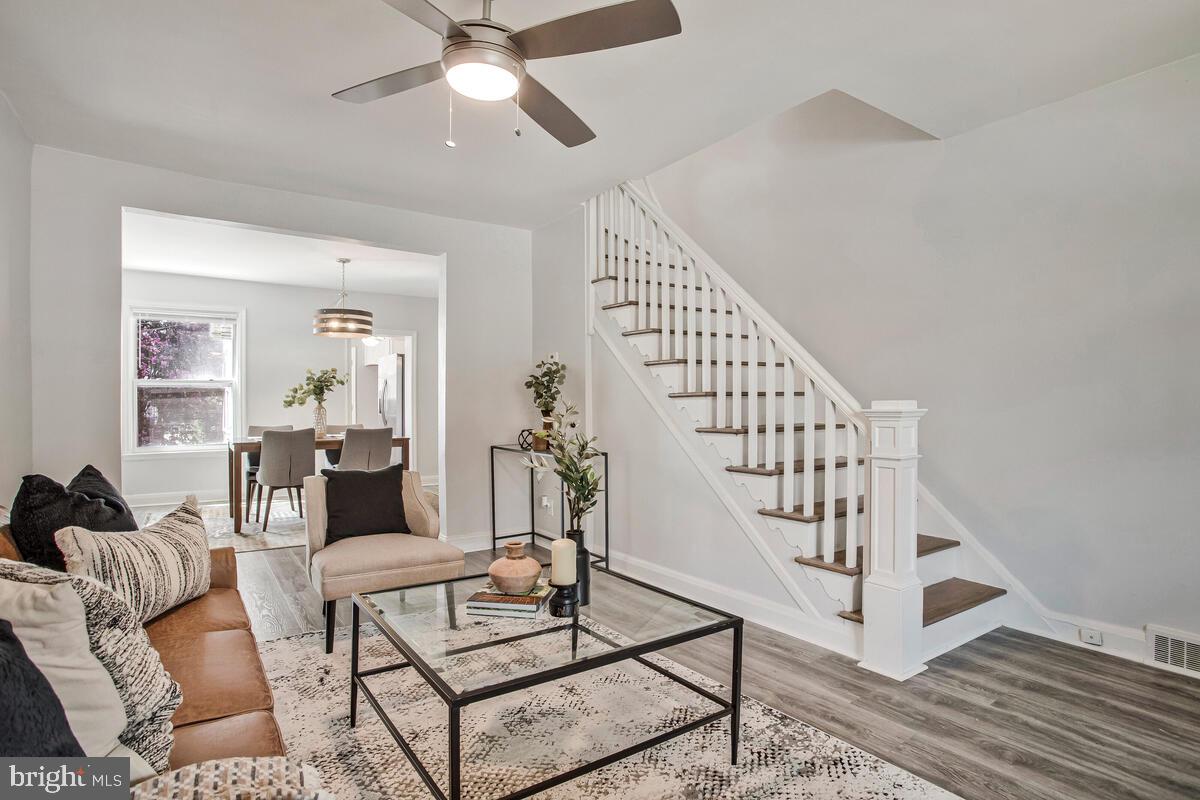 617 Annabel Avenue Baltimore, MD 21225 - Photo 8 of 40 a living room with lots of furniture and wooden floor