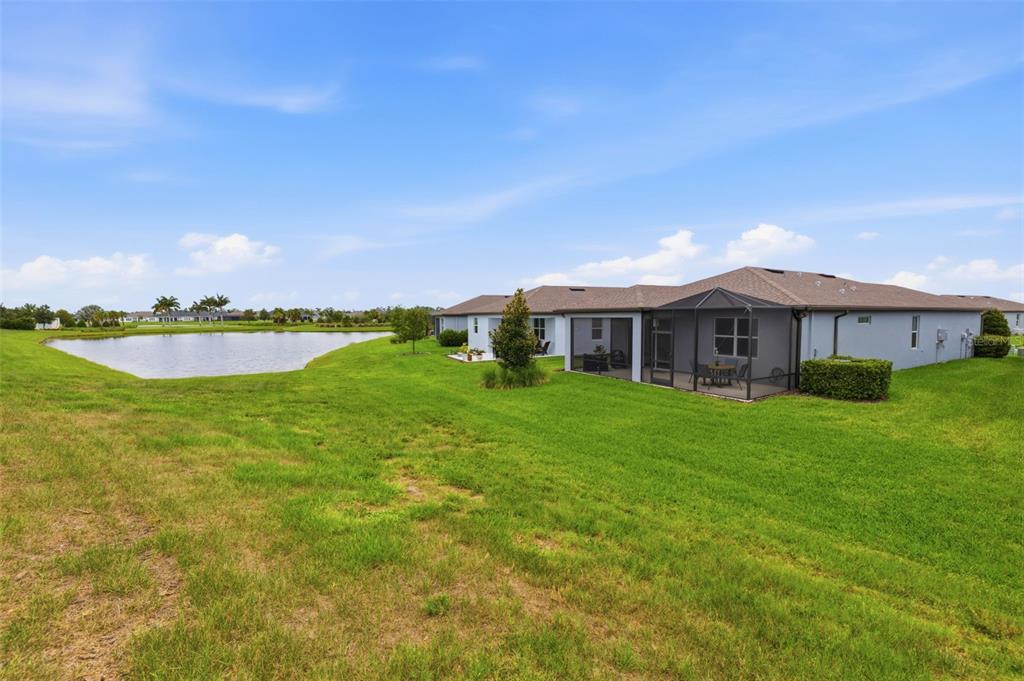 10462 Spring Tide Way Palmetto, FL 34221 - Photo 19 of 21 a front view of a house with garden