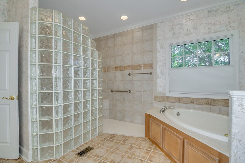 240 Forest Pines Road Aiken, SC 29803 - Photo 18 of 32 Tiled walk-in shower and soaker tub