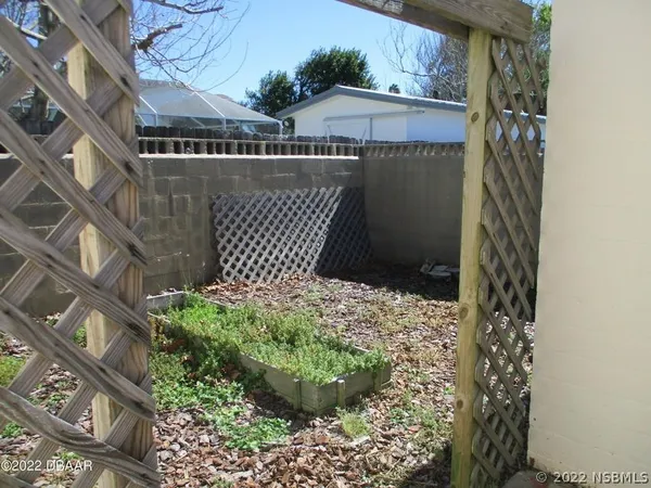 a view of a house with yard and a garden