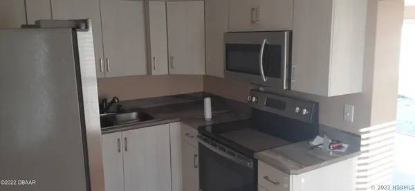 a view of an empty room with a window