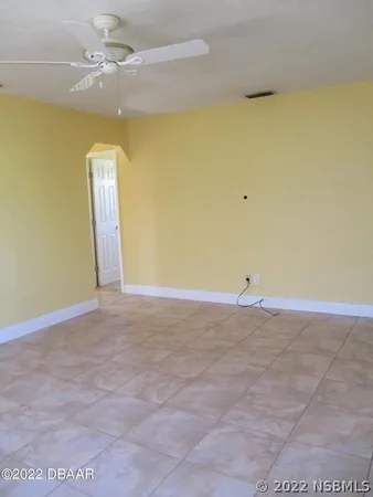 a view of a big room with carpet