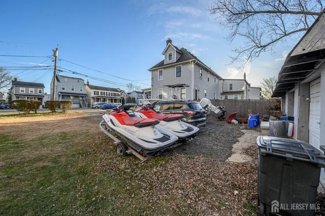 a wooden bench sitting in middle of a yard