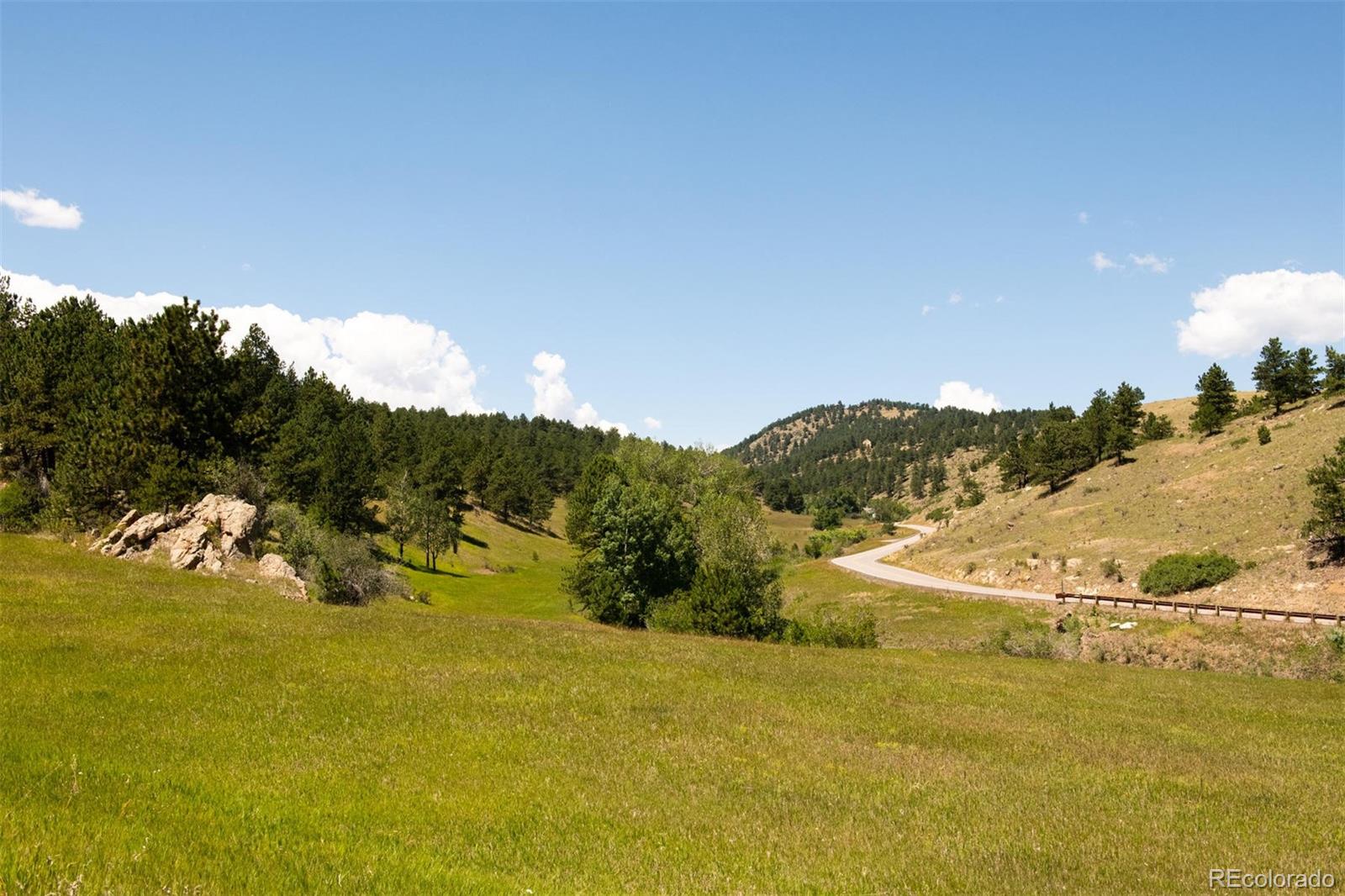 2345 Legacy Ranch Road Evergreen, CO 80439 - Photo 9 of 12 a view of lake with mountain