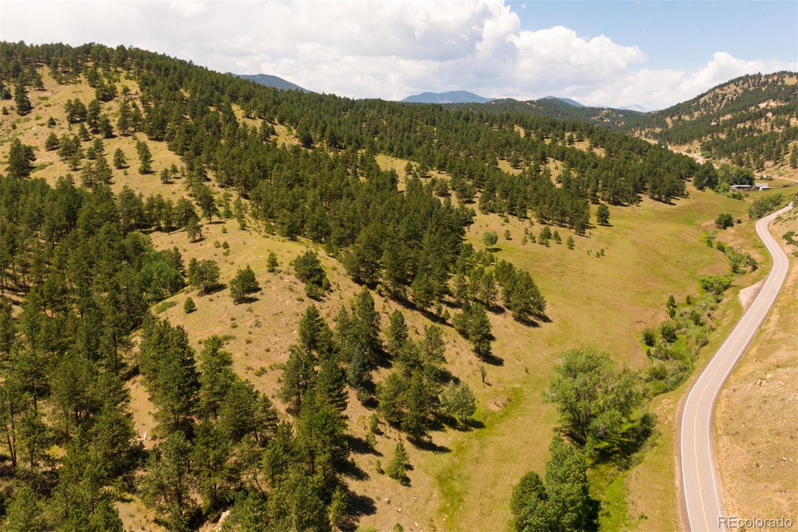2345 Legacy Ranch Road Evergreen, CO 80439 - Photo 10 of 12 a view of a city with mountains in the background
