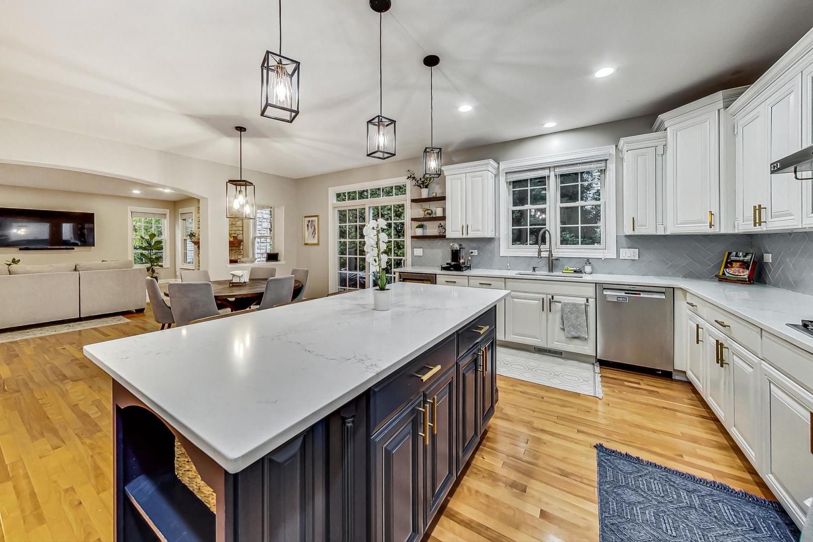 2680 Summit Drive Glenview, IL 60025 - Photo 17 of 70 a large kitchen with kitchen island a sink counter space appliances and a window