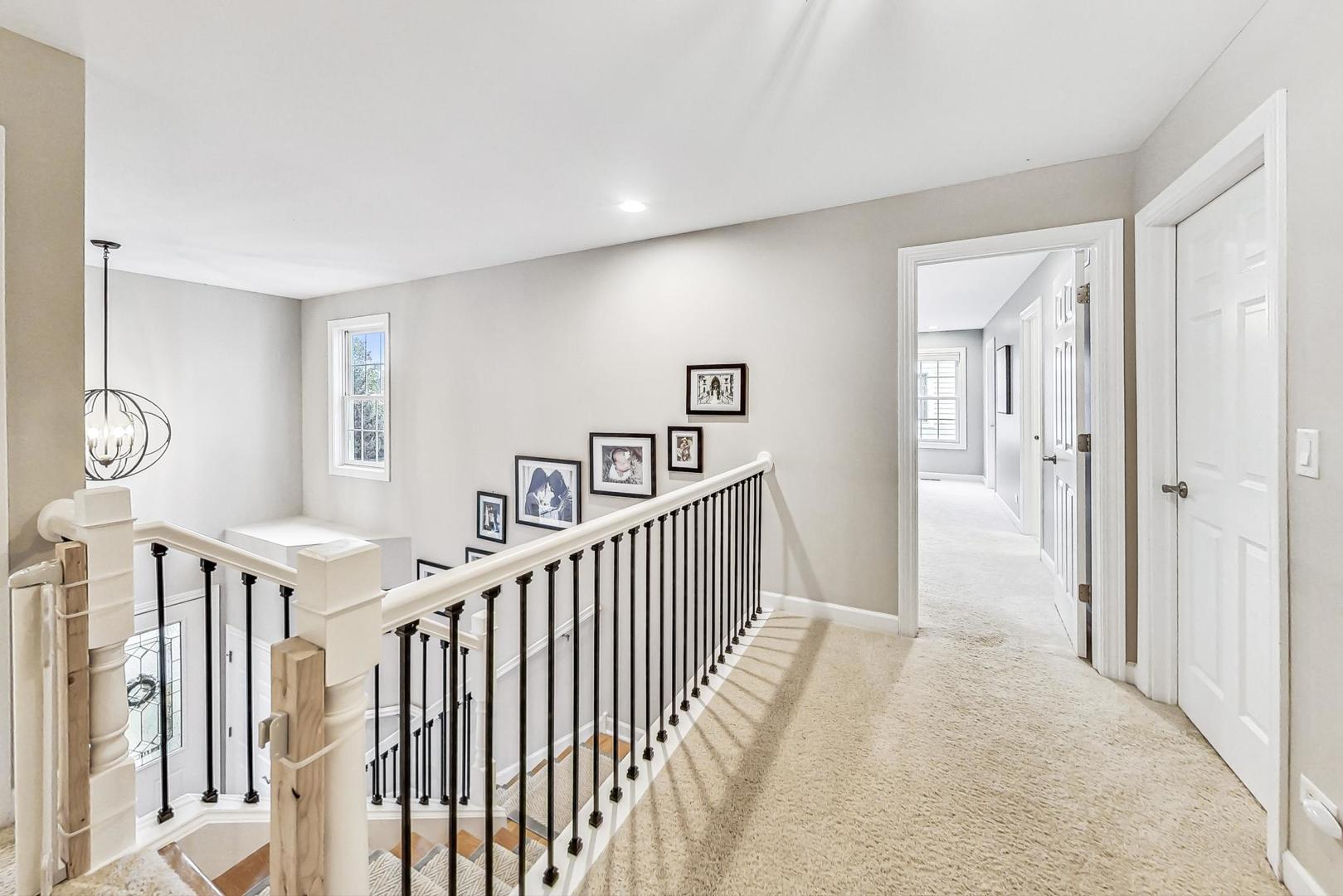 2680 Summit Drive Glenview, IL 60025 - Photo 36 of 70 a view of a hallway with windows and stairs