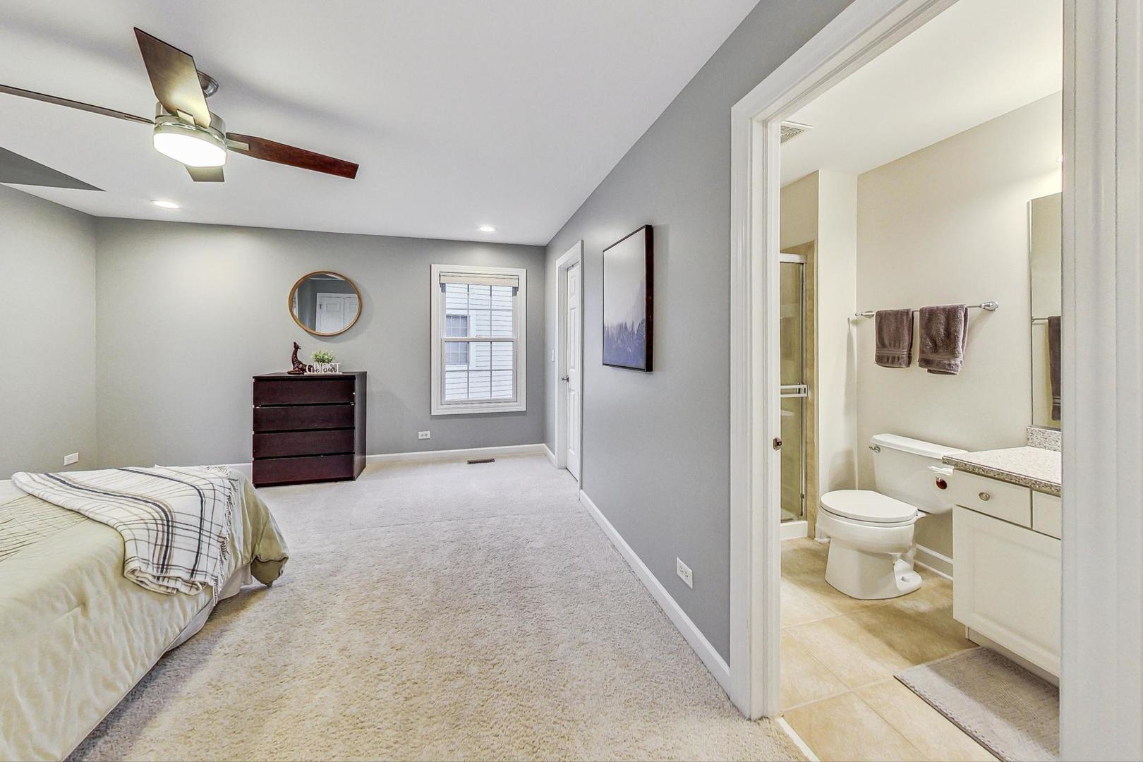 2680 Summit Drive Glenview, IL 60025 - Photo 38 of 70 a bedroom with a bed and a view of bathroom