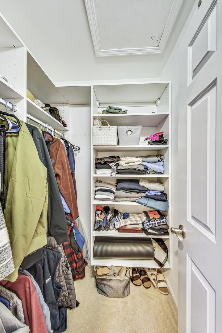 2680 Summit Drive Glenview, IL 60025 - Photo 41 of 70 a view of walk in closet with clothes and shoes