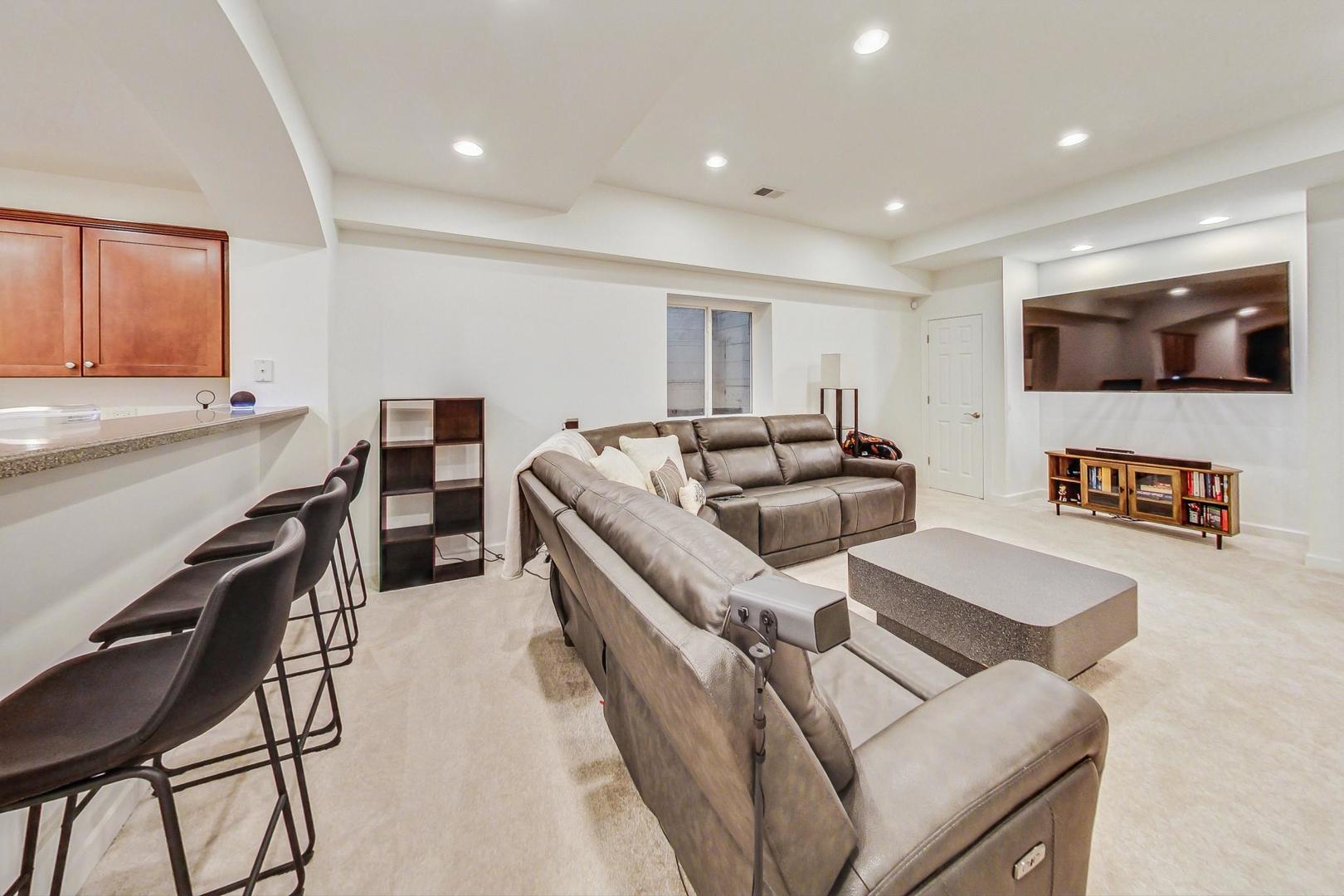 2680 Summit Drive Glenview, IL 60025 - Photo 48 of 70 a kitchen with stainless steel appliances kitchen island granite countertop a sink and chairs