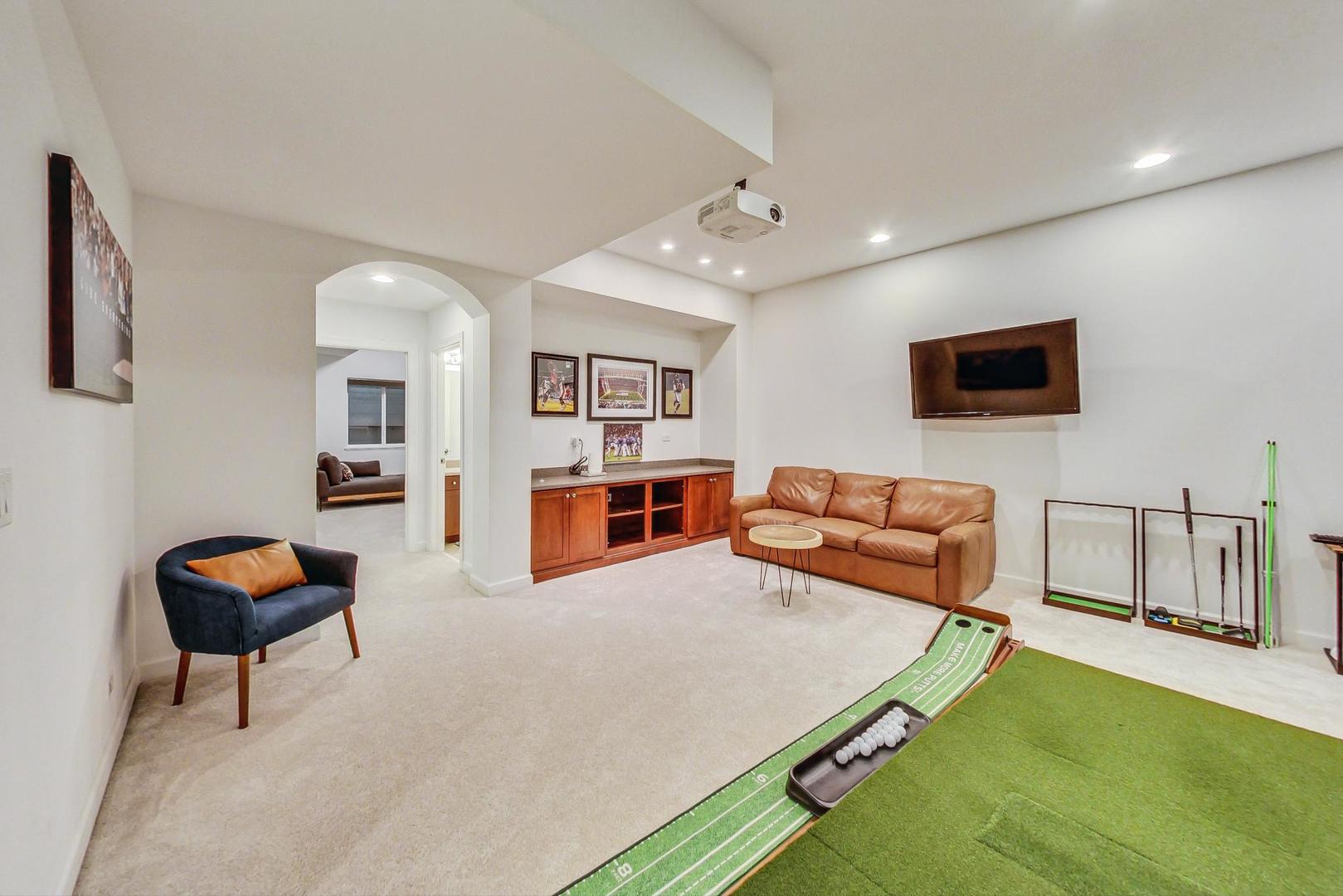 2680 Summit Drive Glenview, IL 60025 - Photo 54 of 70 a living room with furniture and a flat screen tv