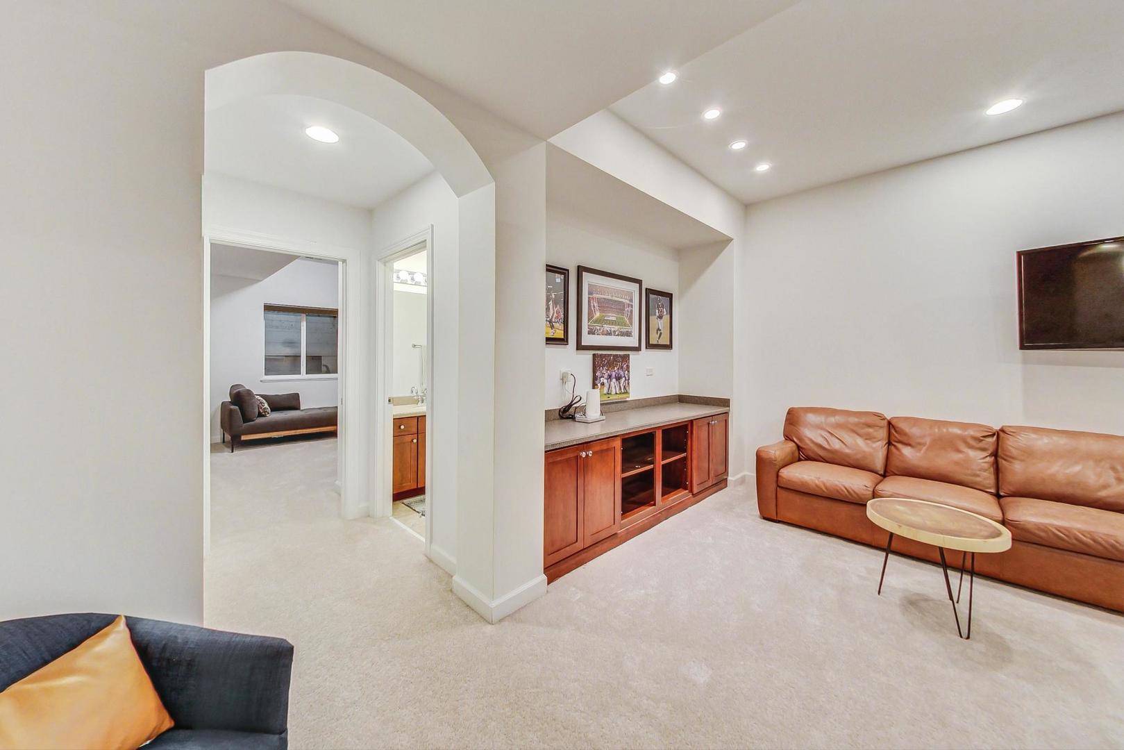 2680 Summit Drive Glenview, IL 60025 - Photo 56 of 70 a living room with furniture and a flat screen tv