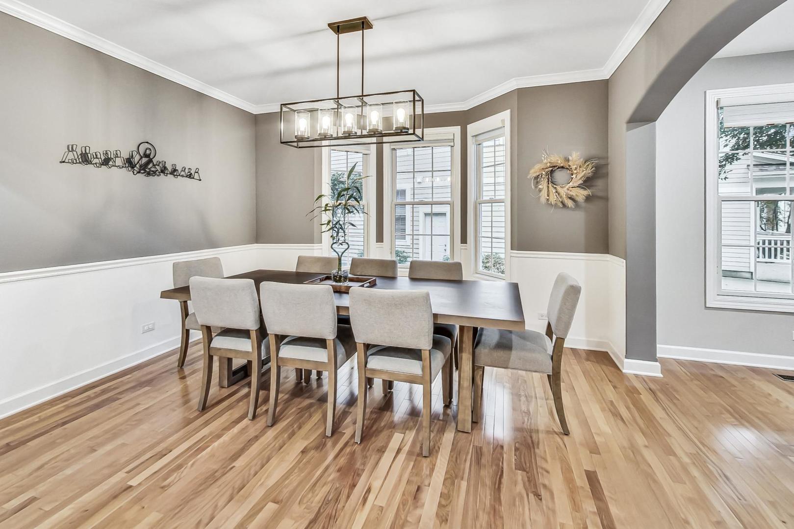 2680 Summit Drive Glenview, IL 60025 - Photo 9 of 70 a view of a dining room with furniture wooden floor and chandelier