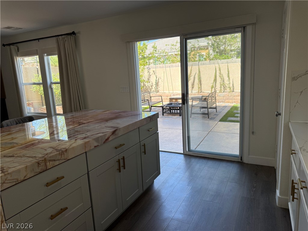 1141 Cathedral Ridge Street Henderson, NV 89052 - Photo 22 of 77 This bright kitchen with a spacious island connects seamlessly to a serene outdoor patio.