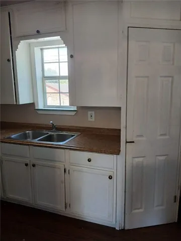 a view of cabinets and window