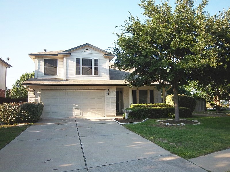a house view with a garden space
