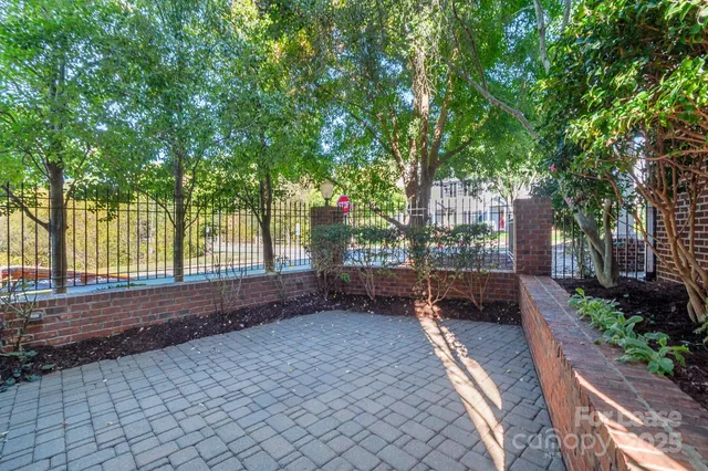 a view of a backyard with sitting area