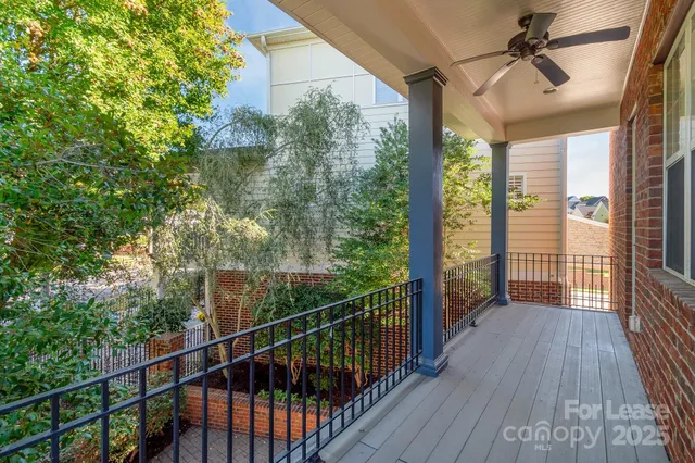 a view of a balcony with wooden floor