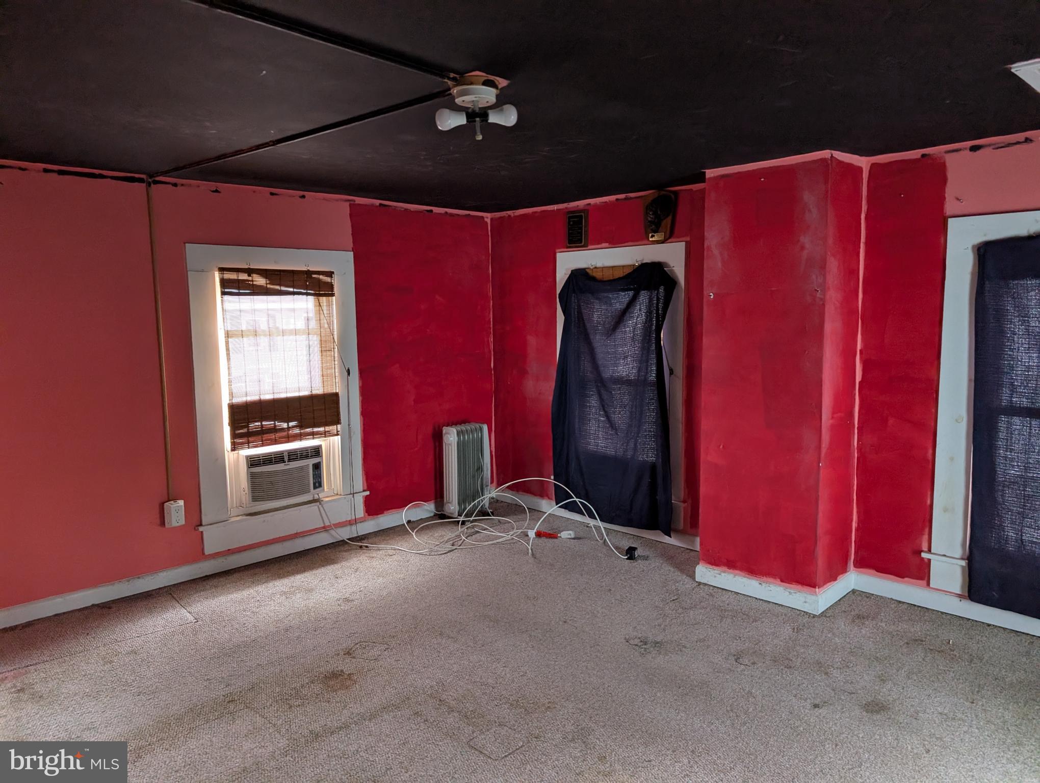 6 West State Street Delmar, MD 21875 - Photo 9 of 10 a view of empty room with red walls