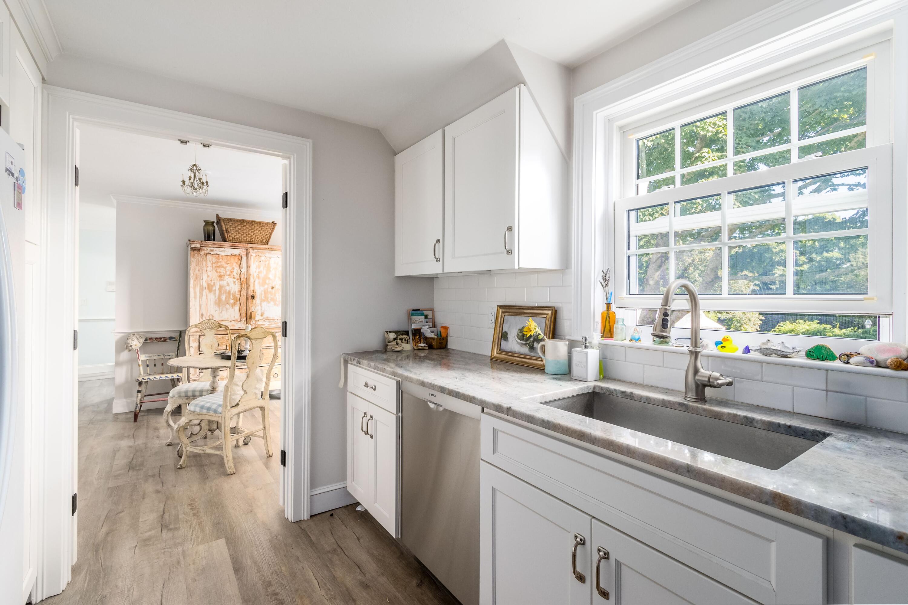 920 Main Street, Unit 4 Osterville, MA 02655 - Photo 16 of 28 a kitchen with stainless steel appliances a sink a stove and a window