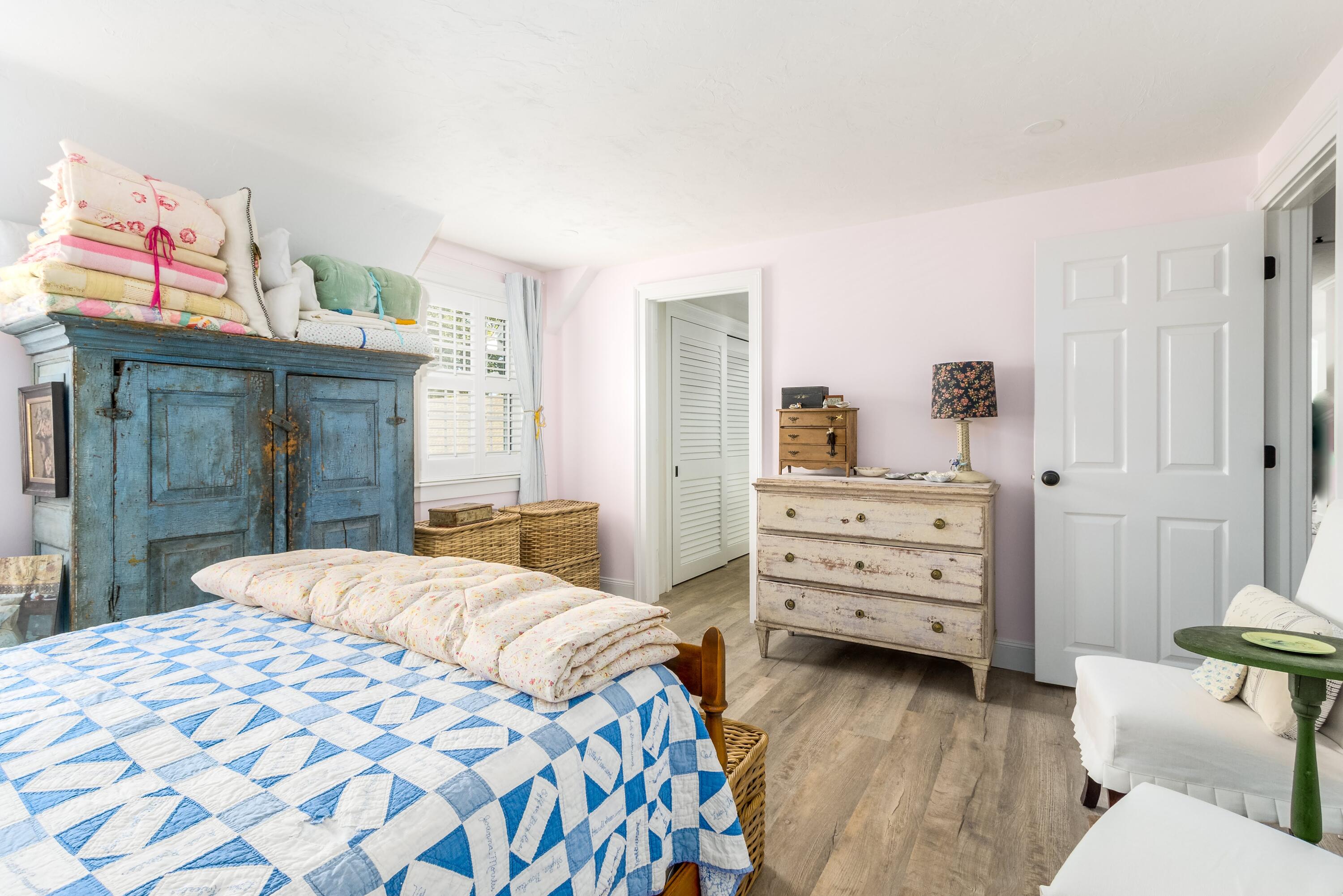 920 Main Street, Unit 4 Osterville, MA 02655 - Photo 20 of 28 a bedroom with a bed and a cabinets