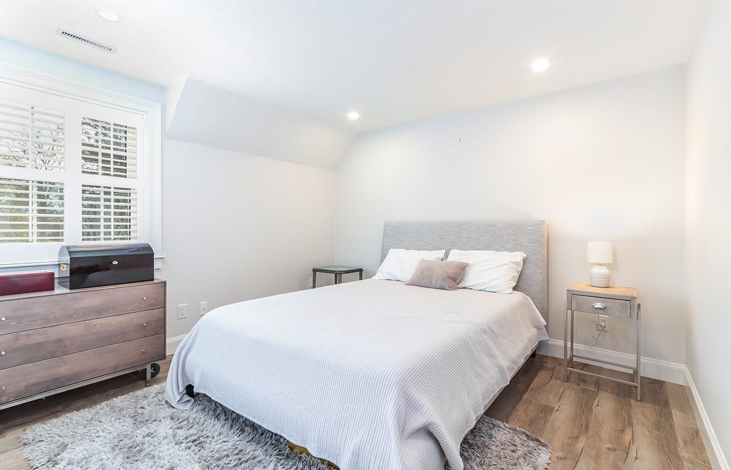 920 Main Street, Unit 4 Osterville, MA 02655 - Photo 23 of 28 a bedroom with a bed and a couch
