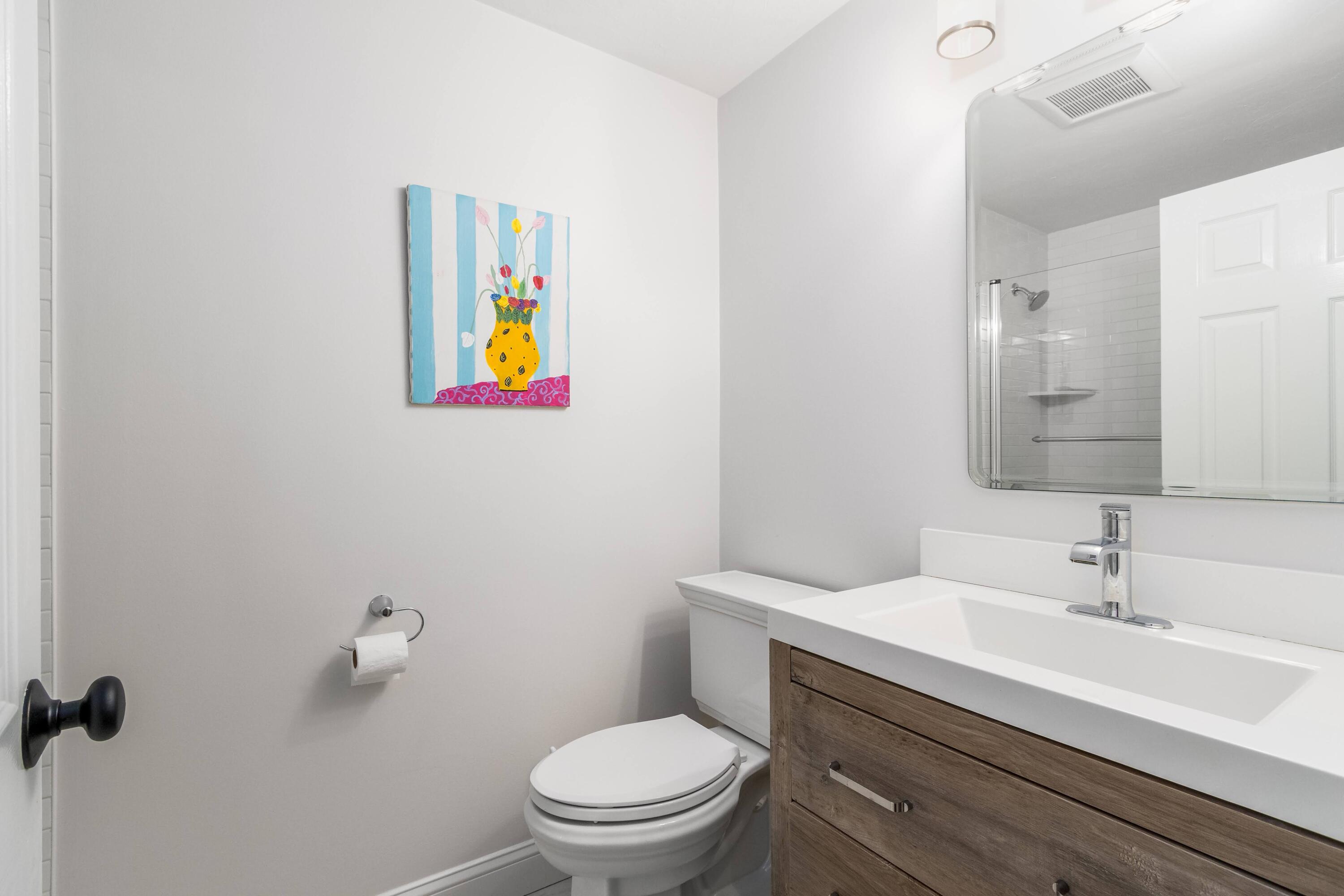 920 Main Street, Unit 4 Osterville, MA 02655 - Photo 25 of 28 a bathroom with a sink mirror vanity and toilet