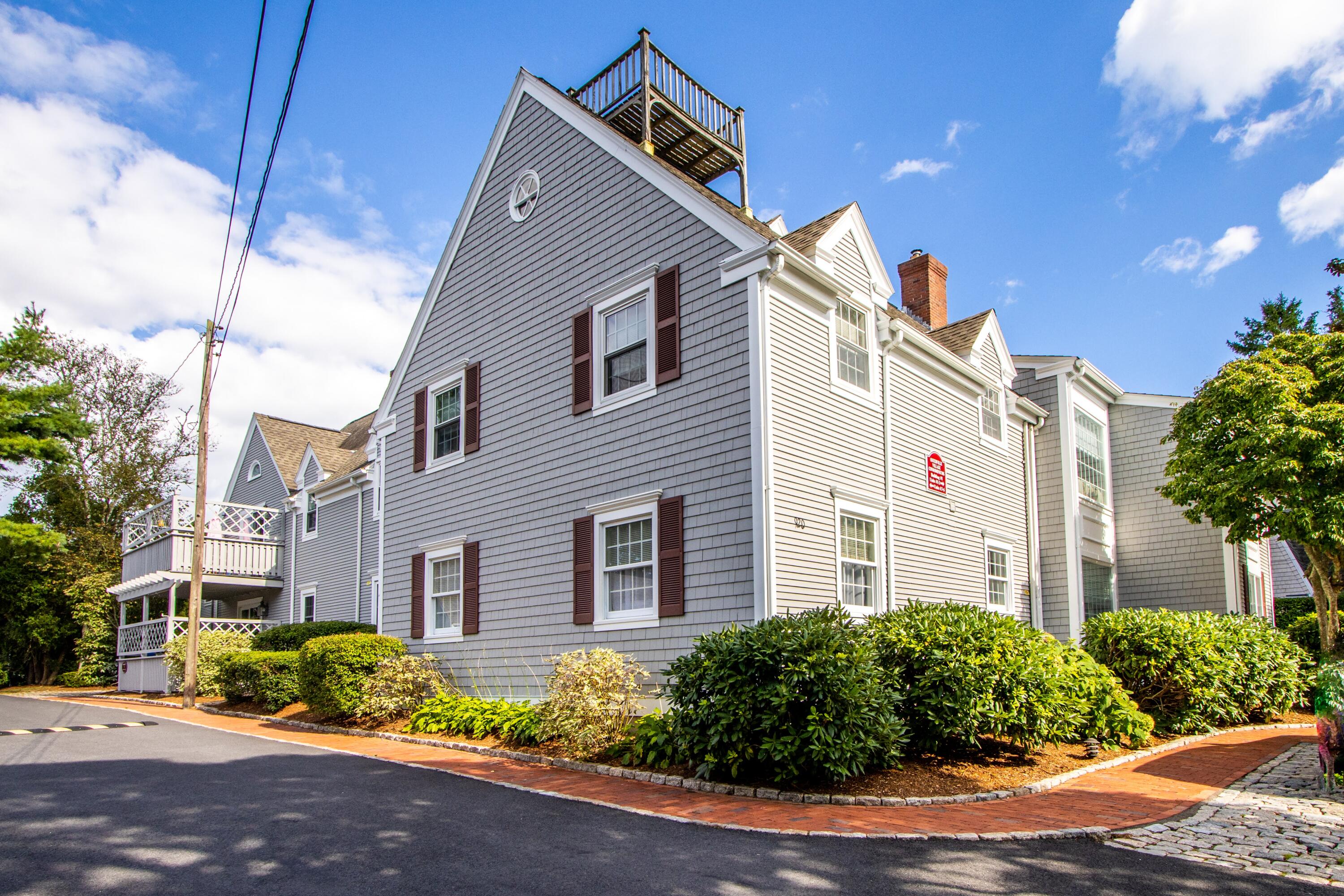 920 Main Street, Unit 4 Osterville, MA 02655 - Photo 3 of 28 a front view of a house with garden
