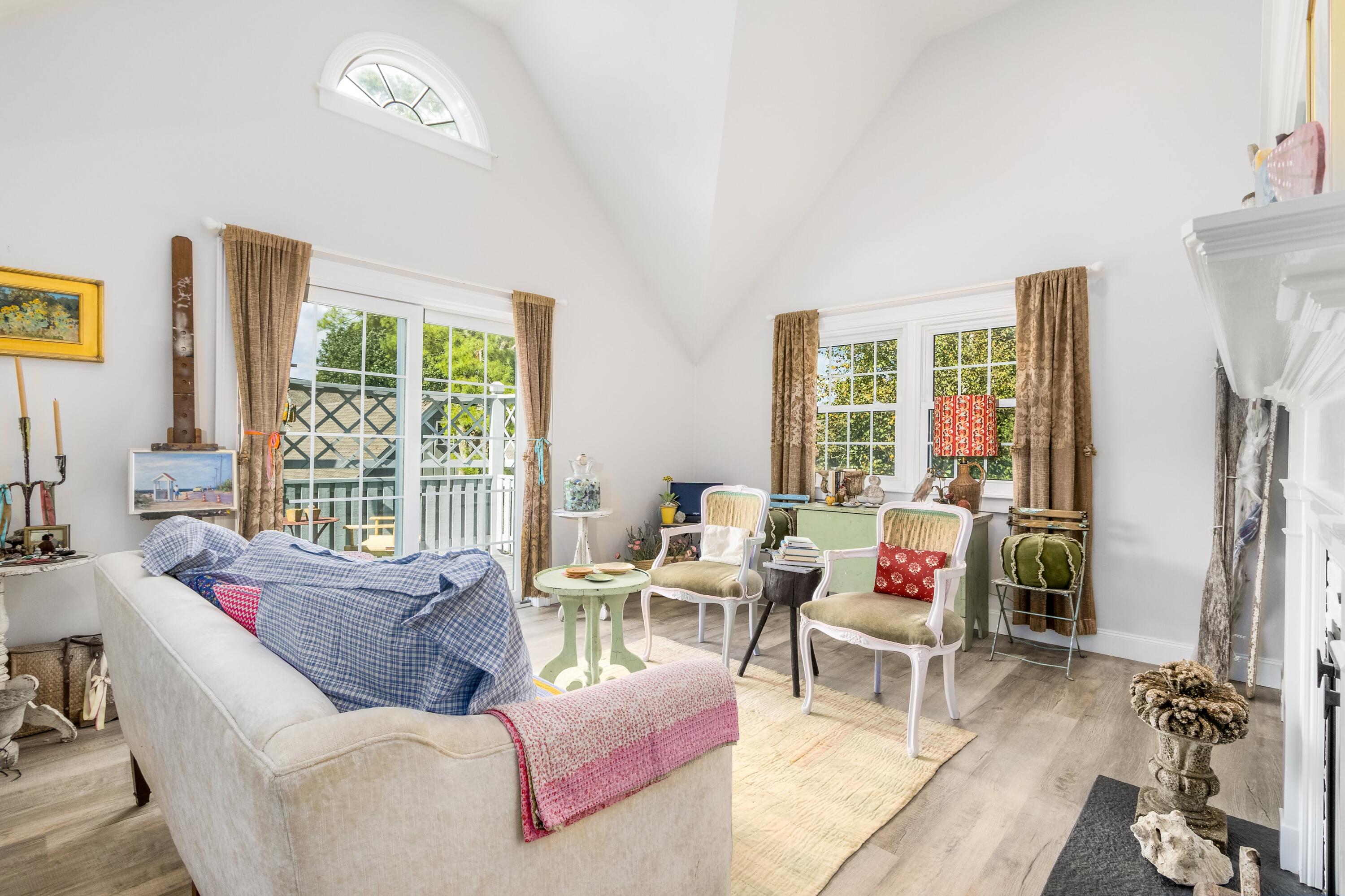 920 Main Street, Unit 4 Osterville, MA 02655 - Photo 8 of 28 a living room with furniture and a floor to ceiling window