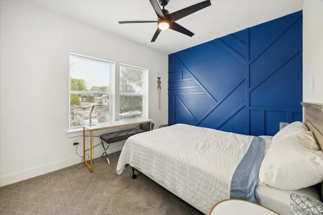 a bedroom with a bed and window