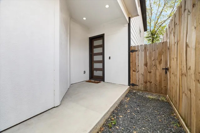 an empty room with a door and a hallway