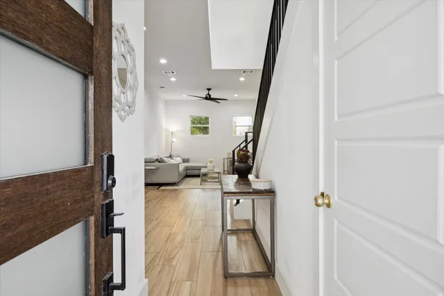 a view of living room with furniture and wooden floor