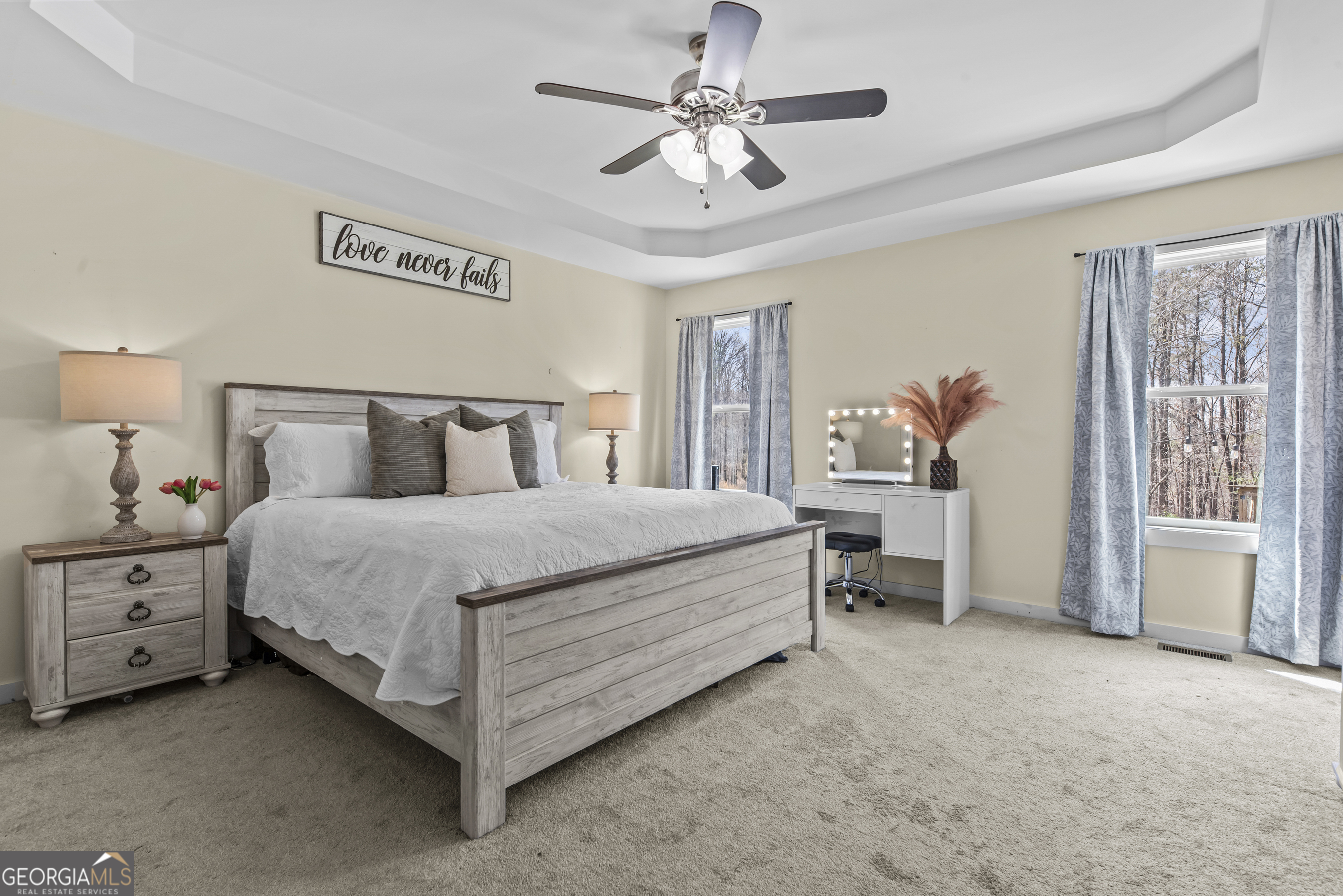 1687 Leon Ellis Road Hull, GA 30646 - Photo 11 of 51 a bedroom with a bed and a chandelier