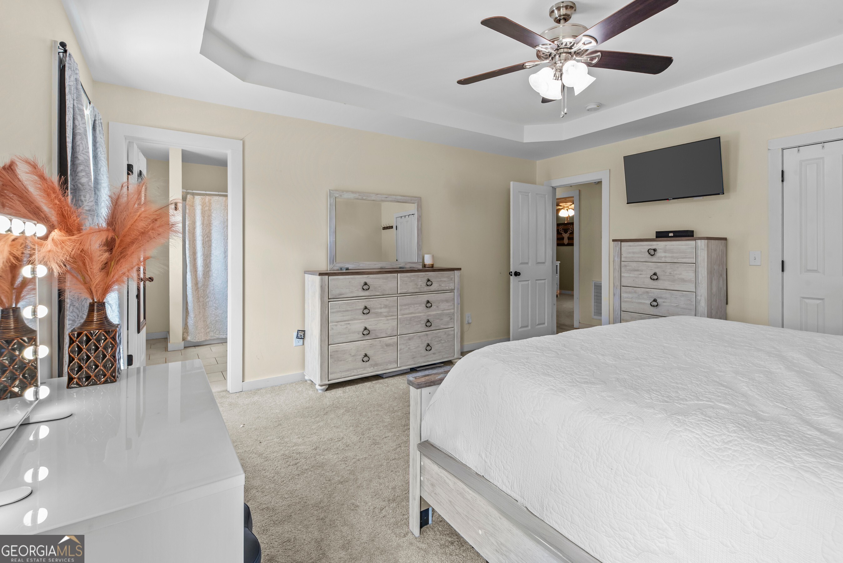 1687 Leon Ellis Road Hull, GA 30646 - Photo 12 of 51 a spacious bedroom with a bed and a flat screen tv