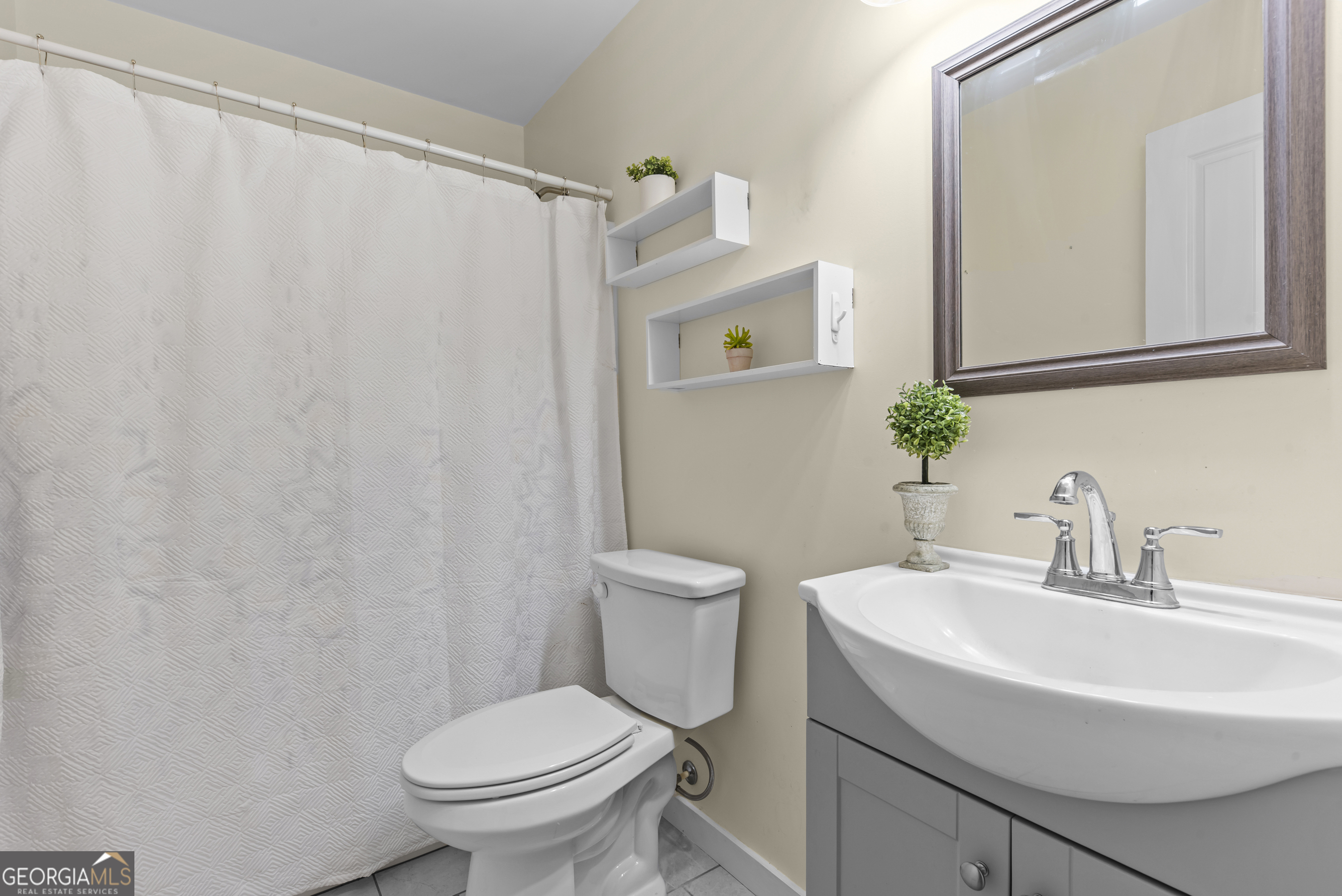 1687 Leon Ellis Road Hull, GA 30646 - Photo 16 of 51 a bathroom with a sink a toilet and a mirror